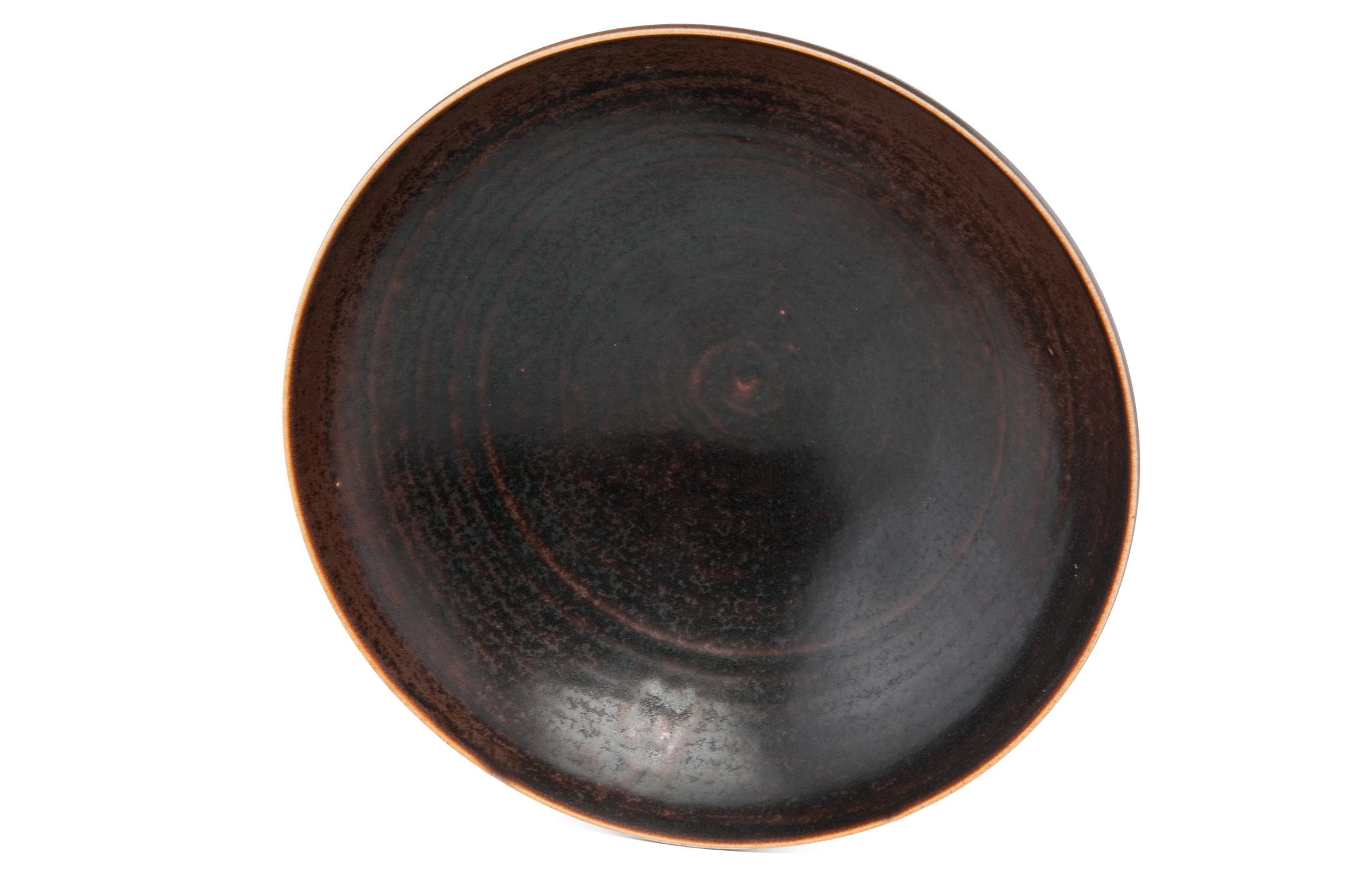 A CERAMIC BOWL.