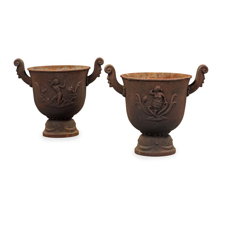 A pair of Ivar Johnsson 'Faun' cast iron urns, Näfveqvarns Bruk.