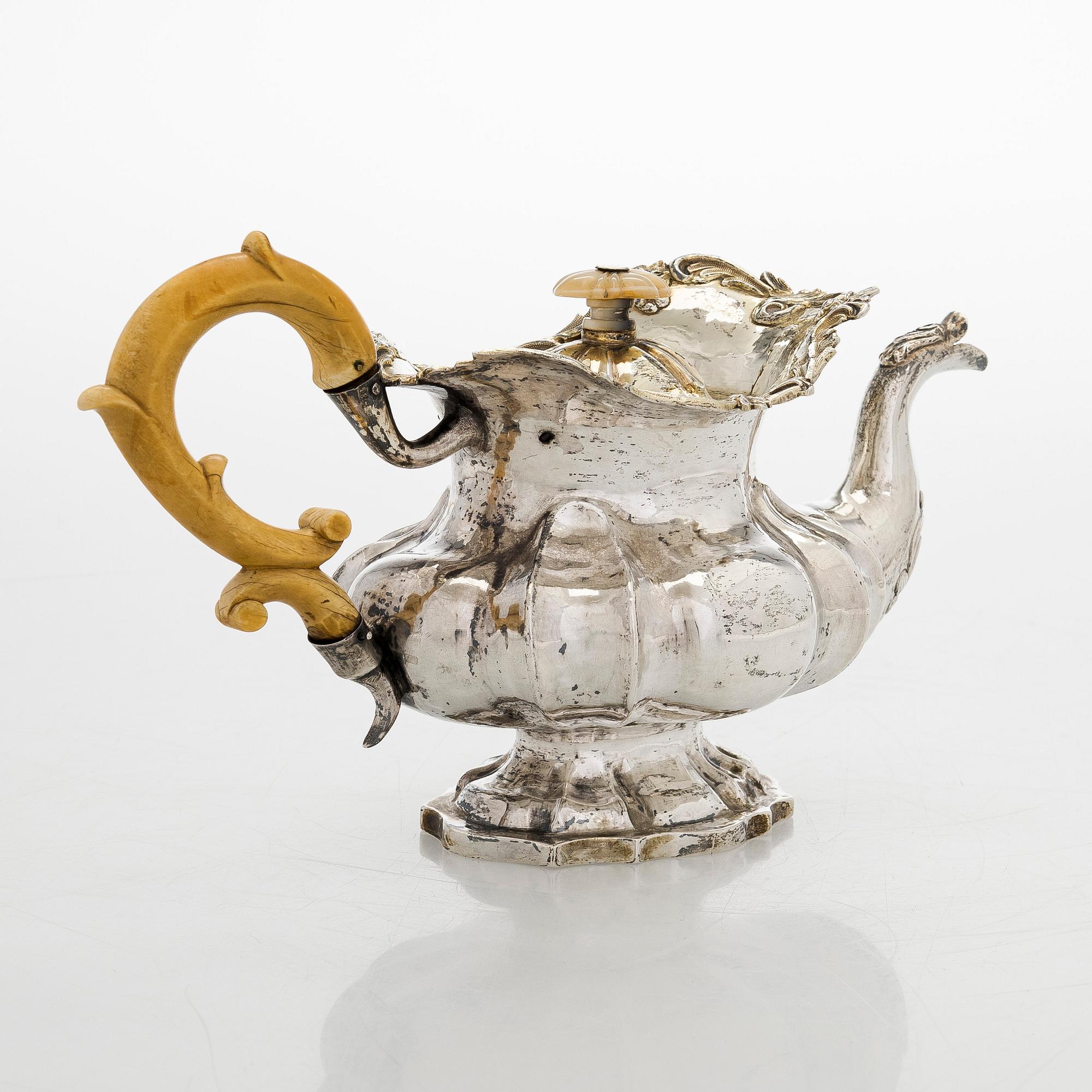 A parcel-gilt silver teapot, Moscow 1845.