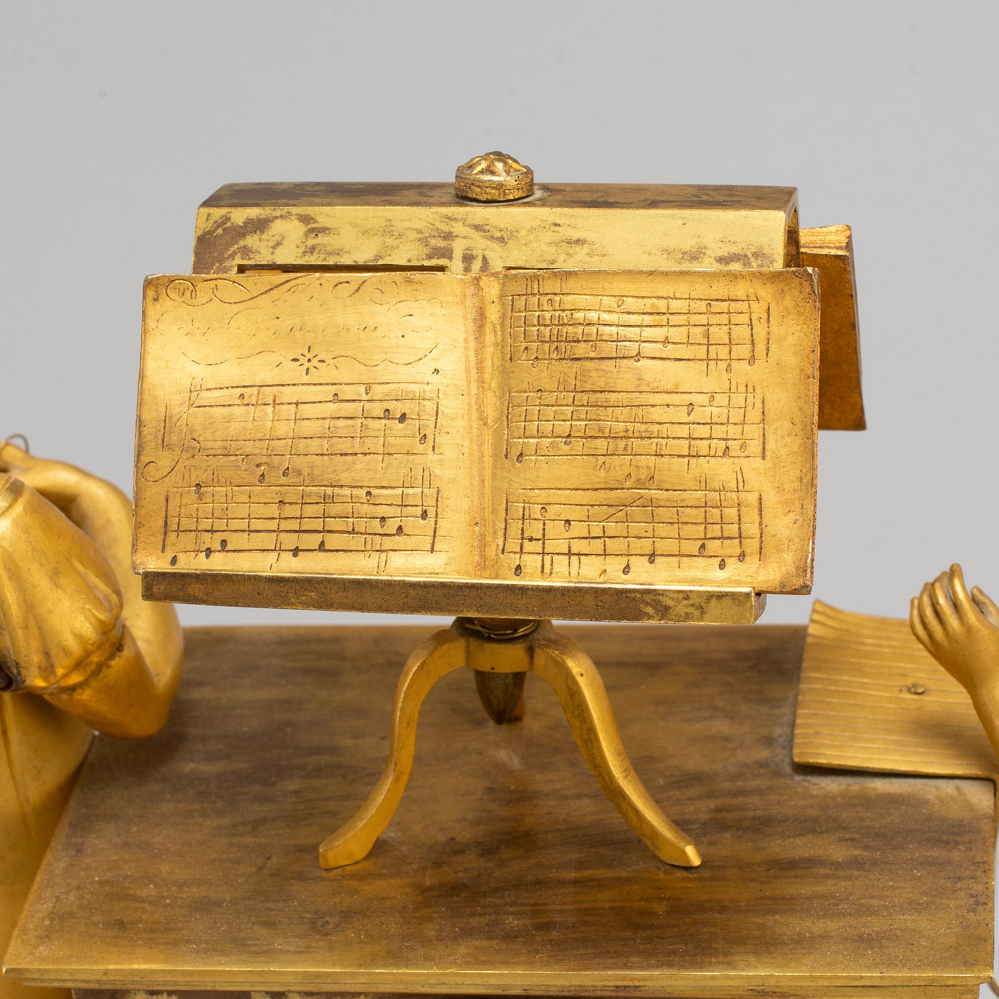 A French Empire gilt bronze mantel clock, first half of the 19th century.