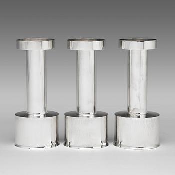 Sigurd Persson, a set of three sterling silver candlesticks, Stockholm 1965 and 1970, executed by Johann Wist.