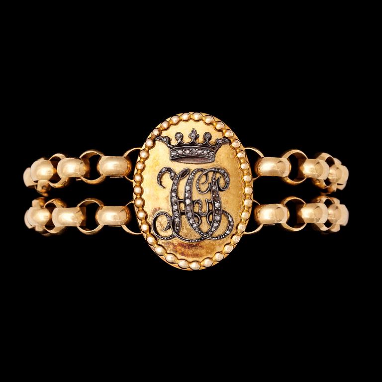 A gold and diamond bracelet, 1908.