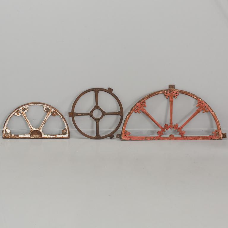 A SET OF THREE CAST IRON WINDOWS.