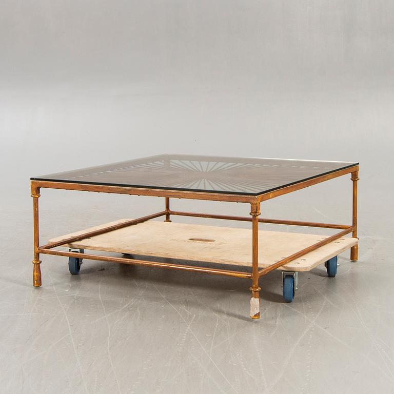 A late 20th century metall and glass coffee table.