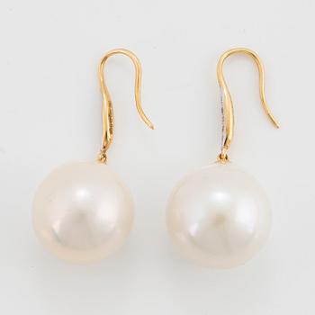 Cultured freshwater pearl and diamond earrings.