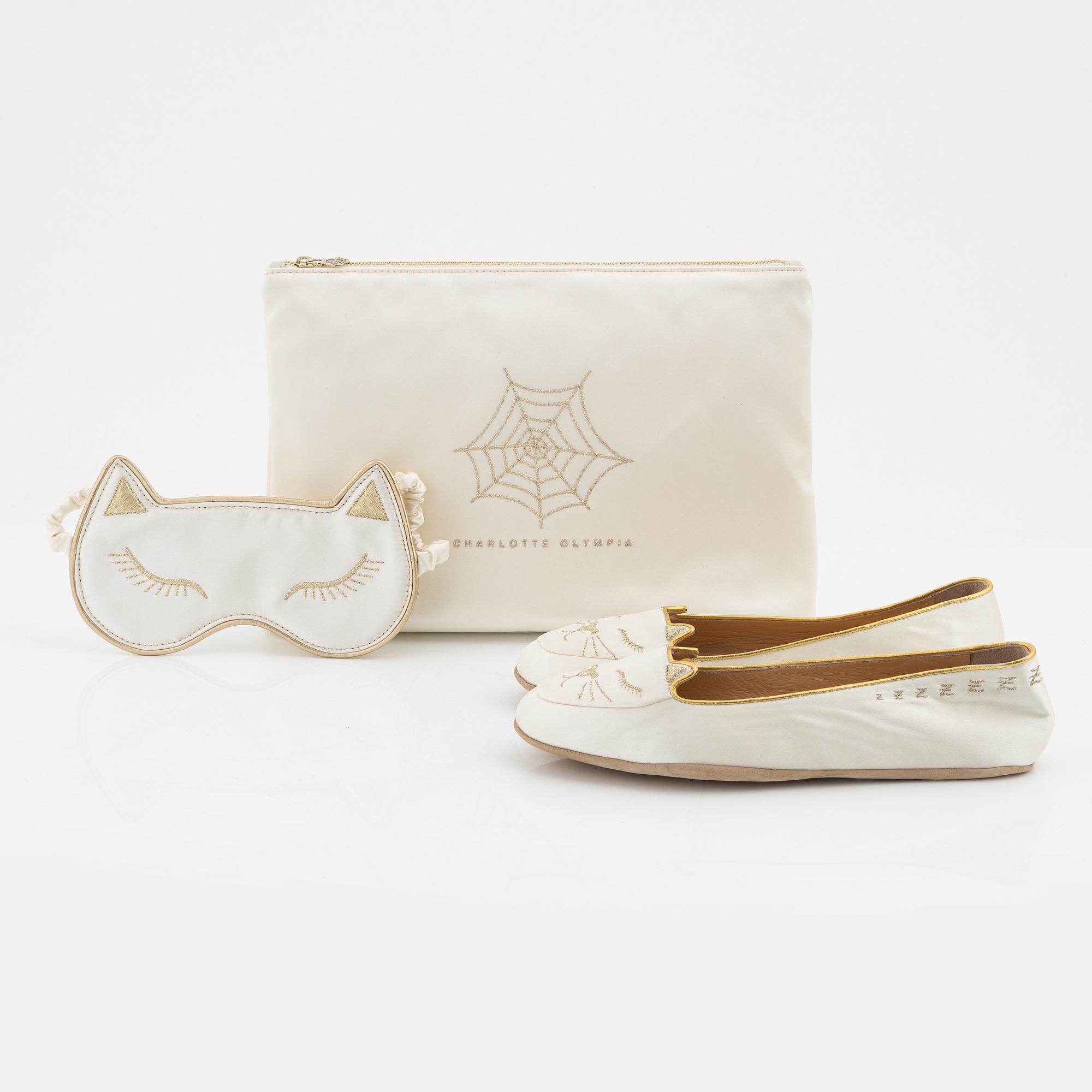 Charlotte Olympia, a pair of 'Cat nap' silk flats, a sleeping mask and a toilet bag, size S.
