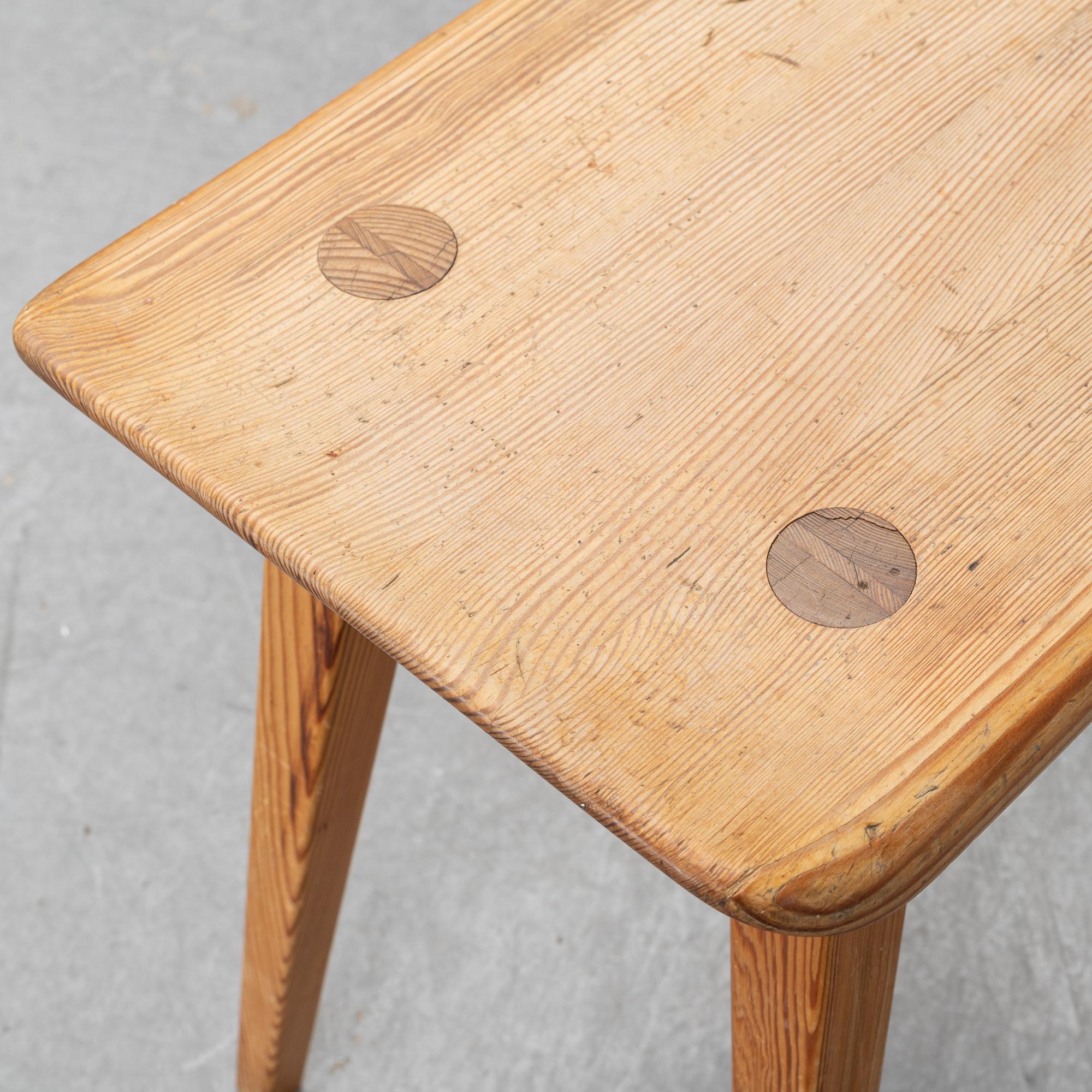 A pine stool by Carl Malmsten for Karl Andersson.