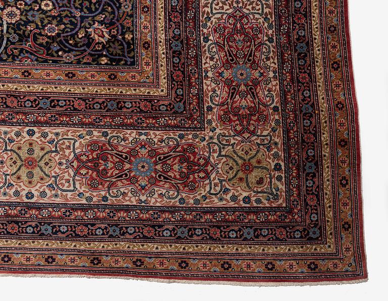 A semi-antique Hereke carpet, Western Turkey, c. 685 x 489 cm.