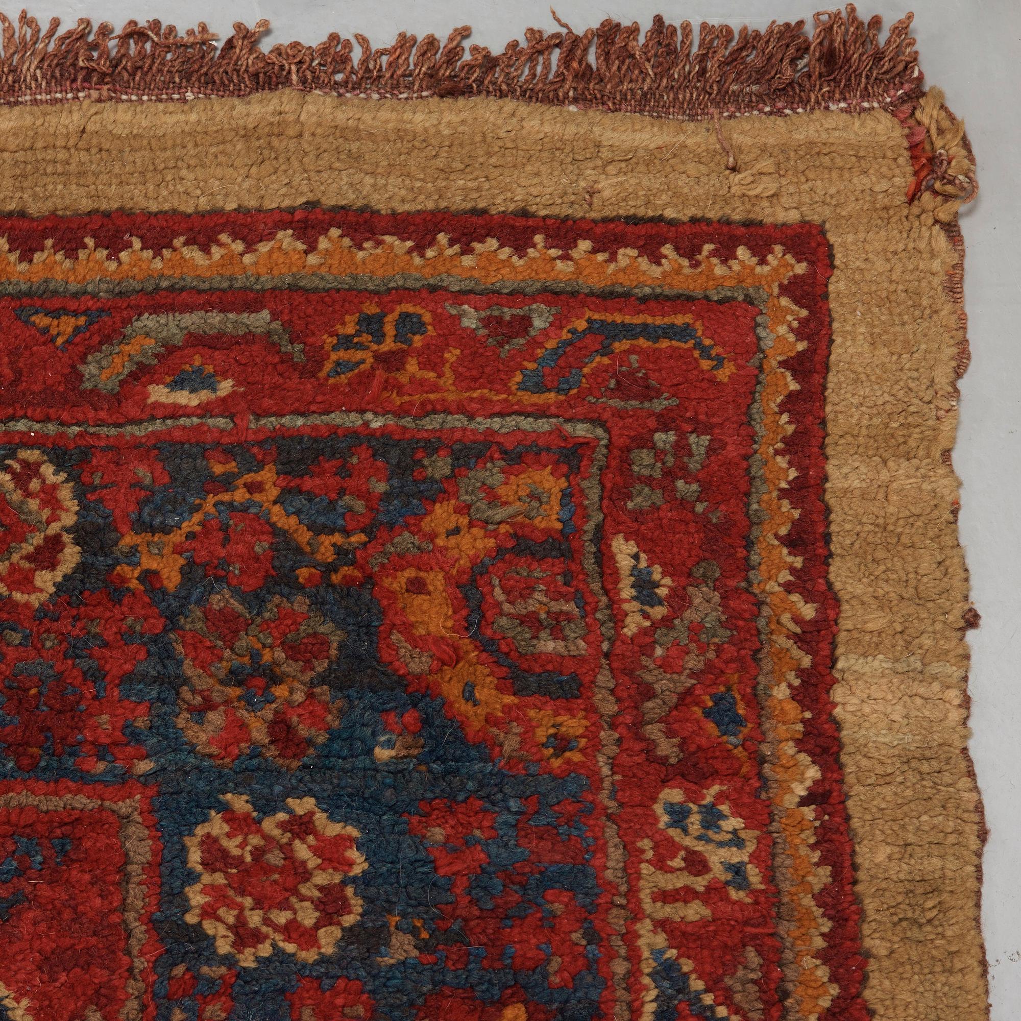 A CARPET. An antique Ushak. 554,5 x 480 cm.