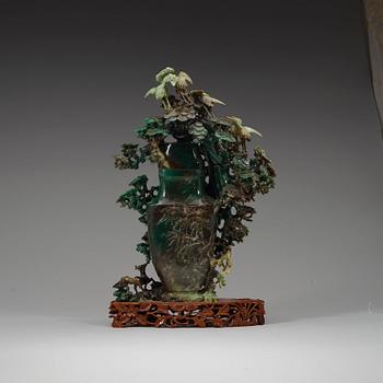 A large, Chinese carved jade pine tree with birds, 20th Century.