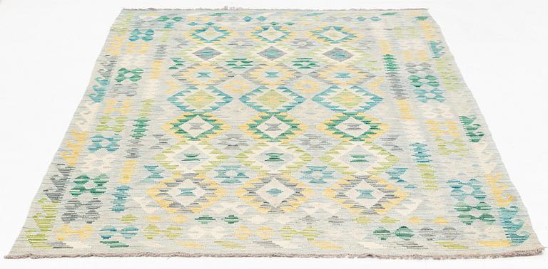 A Kilim rug, c. 245 x 162 cm.