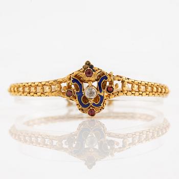 Bracelet, gilded metal with paste stones and enamel.