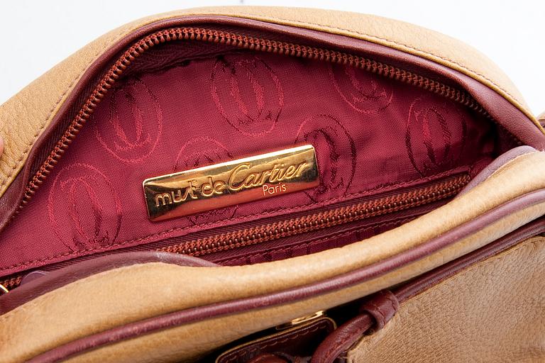 A HANDBAG, Cartier.