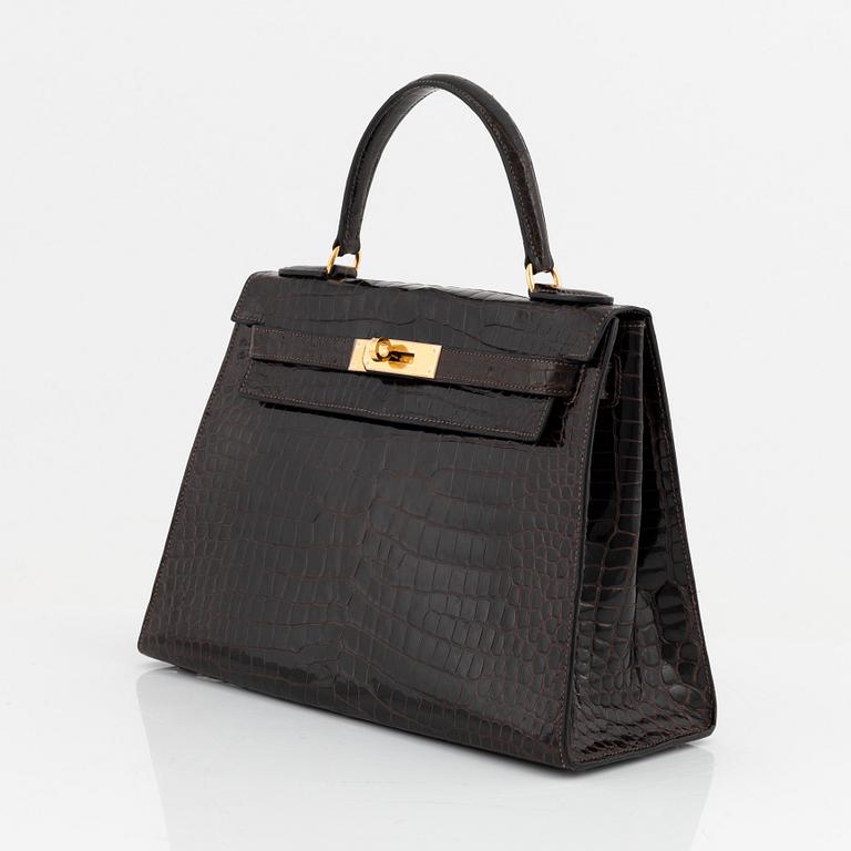 Hermès, A brown Alligator Mississippiensis "Kelly 28", 1964.