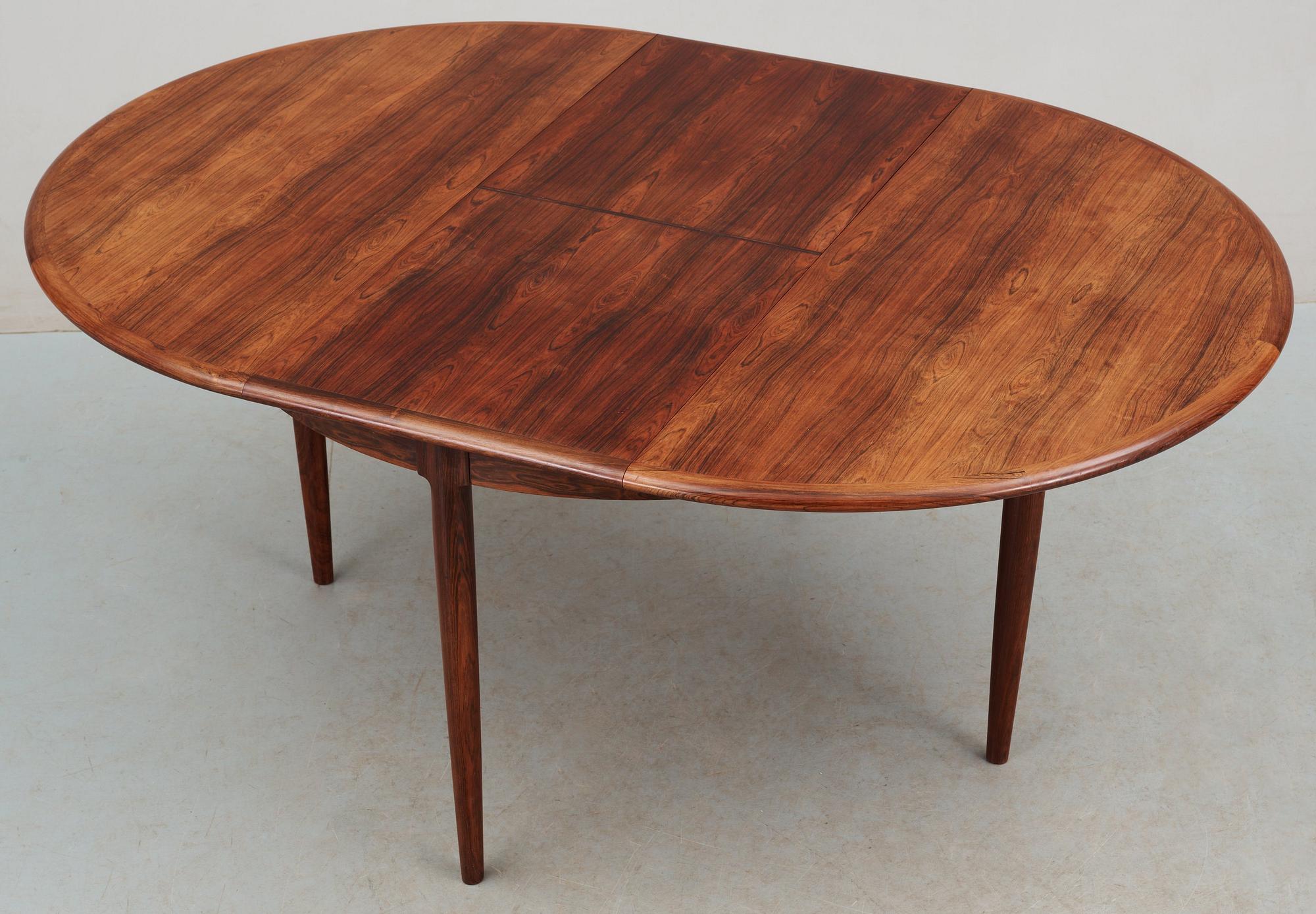 A Niels Ole Møller palisander dining table and nine chairs, J.L. Møller, Denmark 1950's-60's.