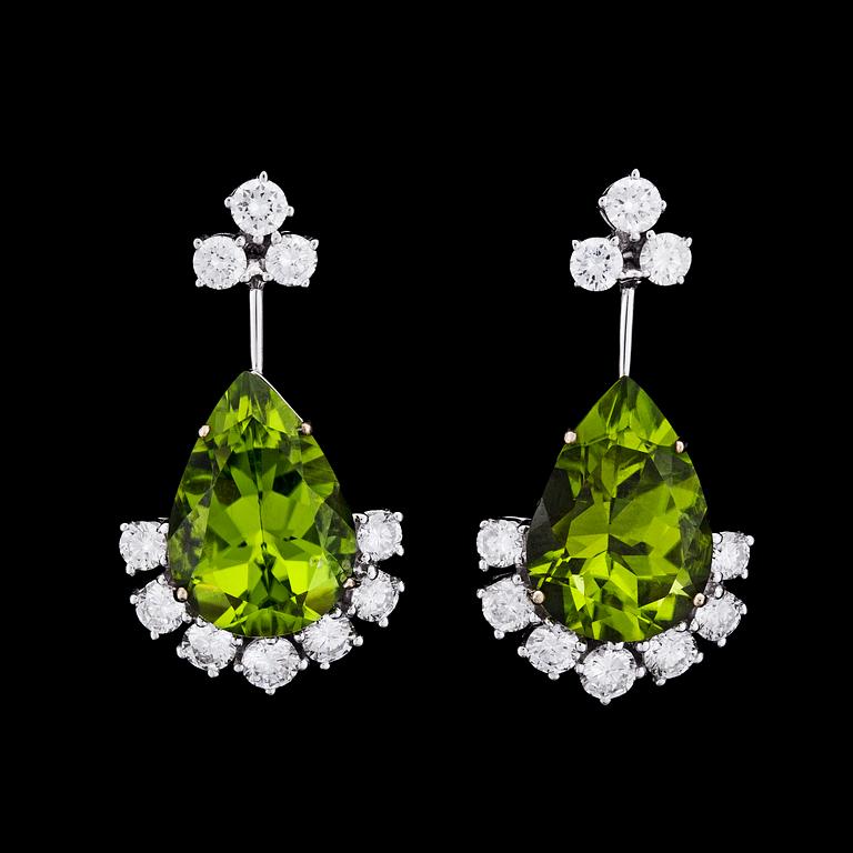 A pair of peridote, tot. 10.83 cts, and brilliant cut diamond earrings, tot. 1.74 cts.