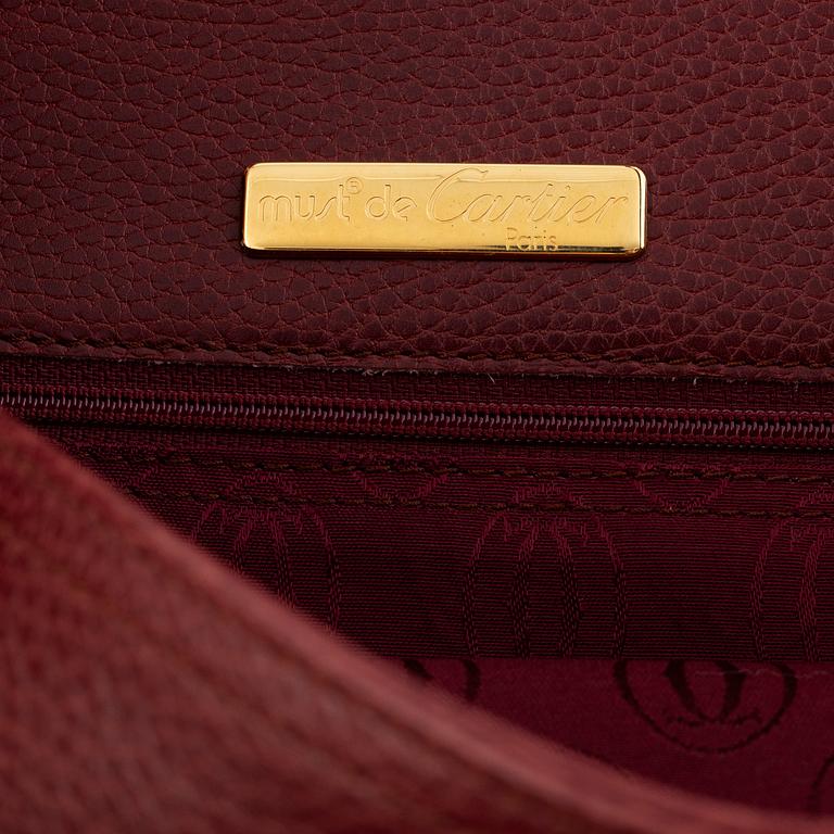 Cartier, a handbag.