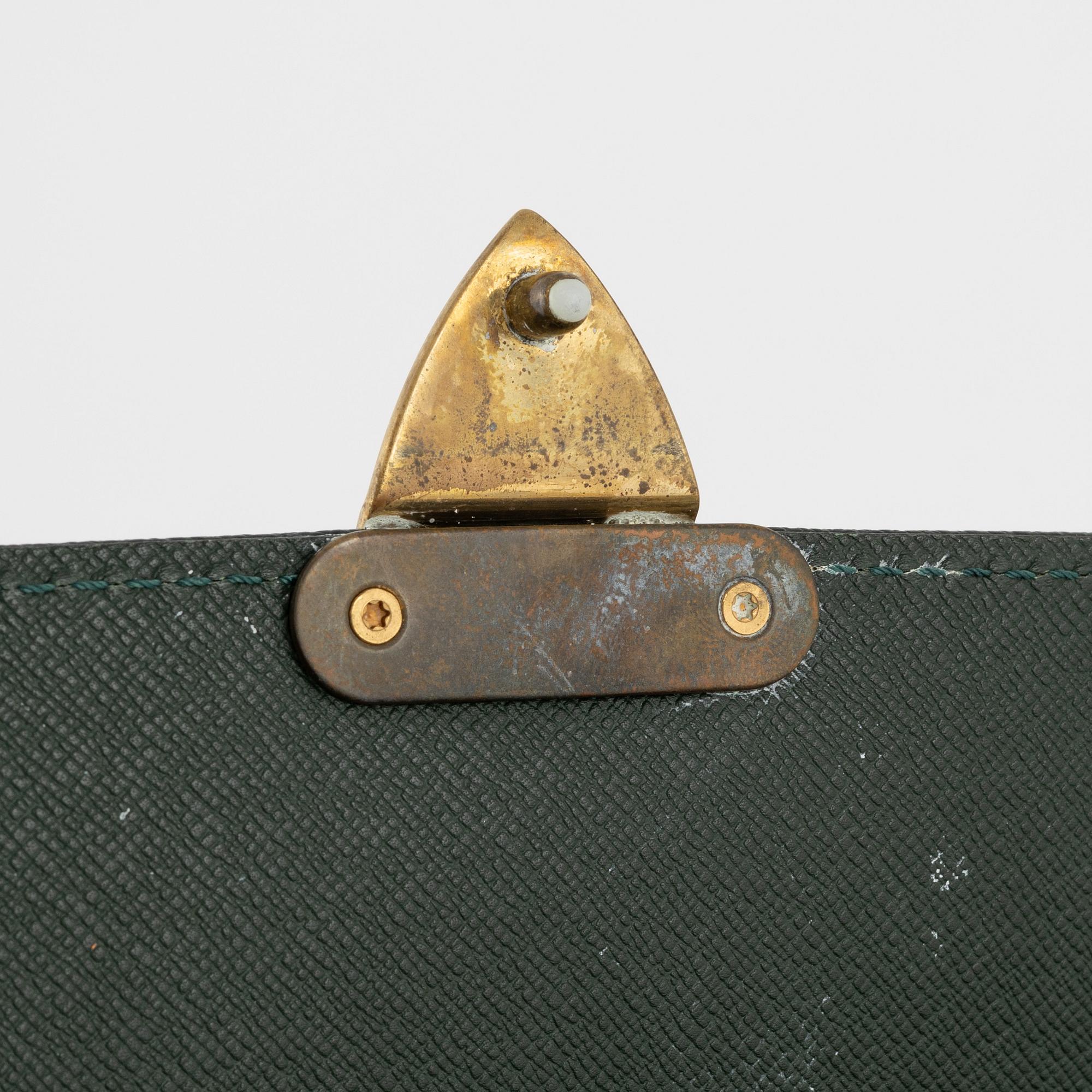 Louis Vuitton, a green Taiga 'Kourad' briefcase, 1997.