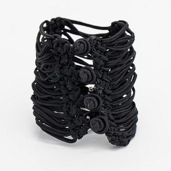 Ole Lynggaard, A satin like band bracelet with an 18K white gold and rose quartz "Sweet drops" pendant.