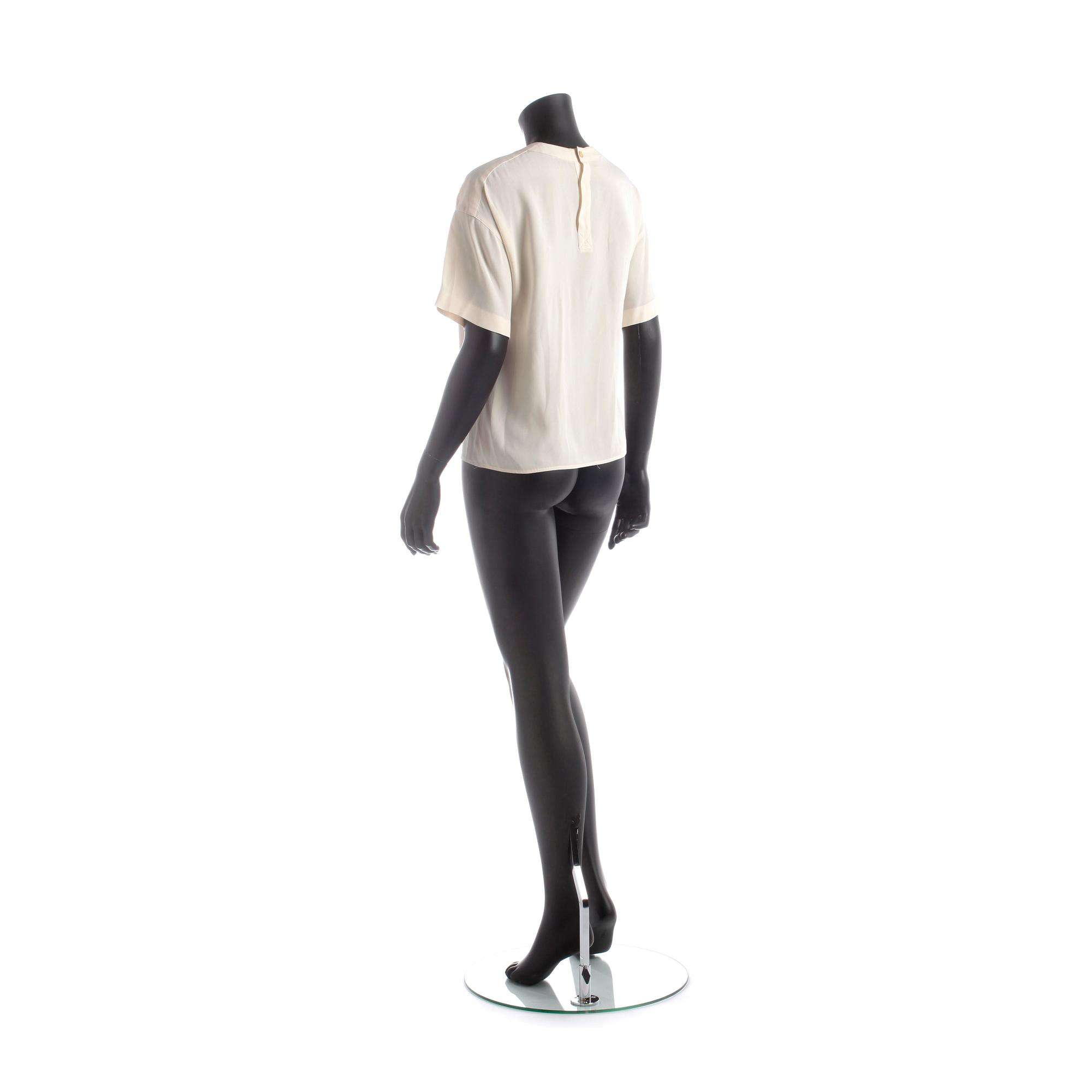 CHANEL, a white silk shirt.