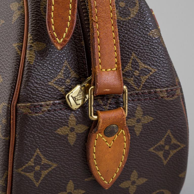 a LOUIS VUITTON bag.