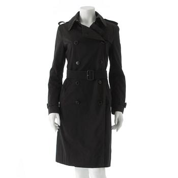 402. BURBERRY, a black cotton trench coat.
