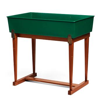 281. Josef Frank, a mahogany and tin flower stand,  Svenskt Tenn Sweden 1950-60's, model no 2084.