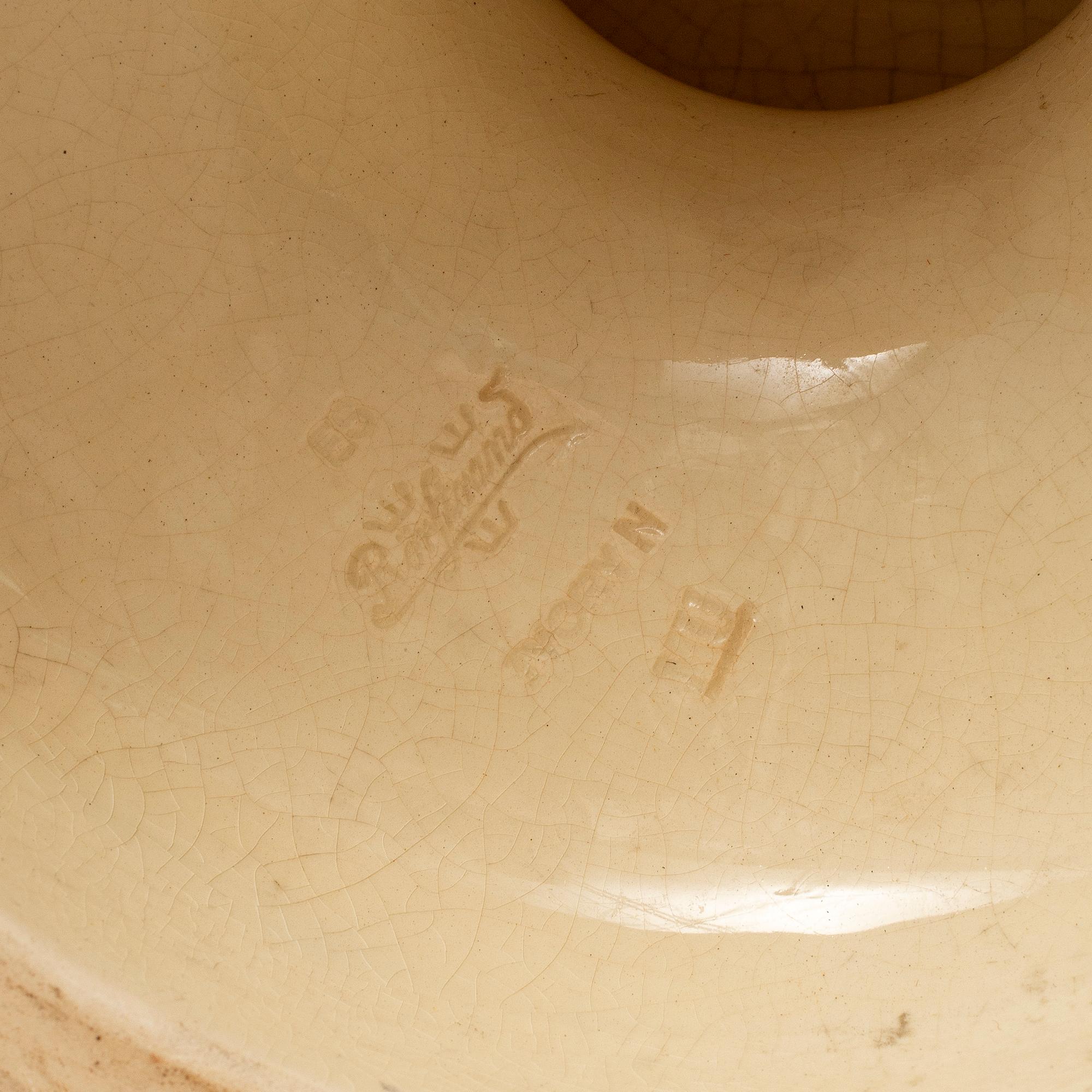 A ceramic pedestal and plant pot from Rörstrand, circa 1900.