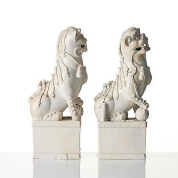 A pair of Chinese blanc de Chine 'Buddhist lion' joss stick holders, Qing dynasty, Kangxi (1662-1722).