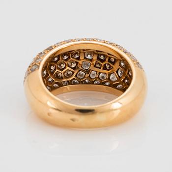 A Cartier "Sauvage" ring in 18K gold set with white and brown round brilliant-cut diamonds.