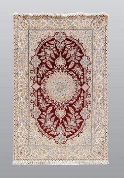 A carpet, Nain part silk s.k 6LAA, 239 x 155 cm.