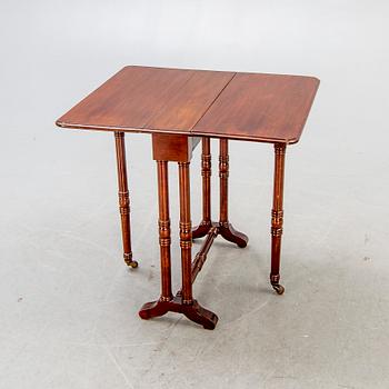 A 20th century English mahogany folding table.