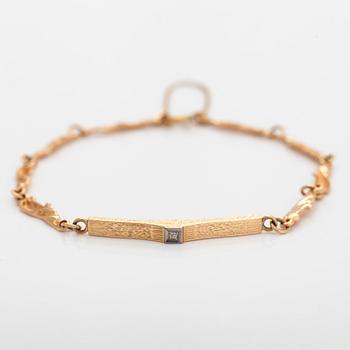 A 14K gold and diamond bracelet. Finnish hallmarks 1980.