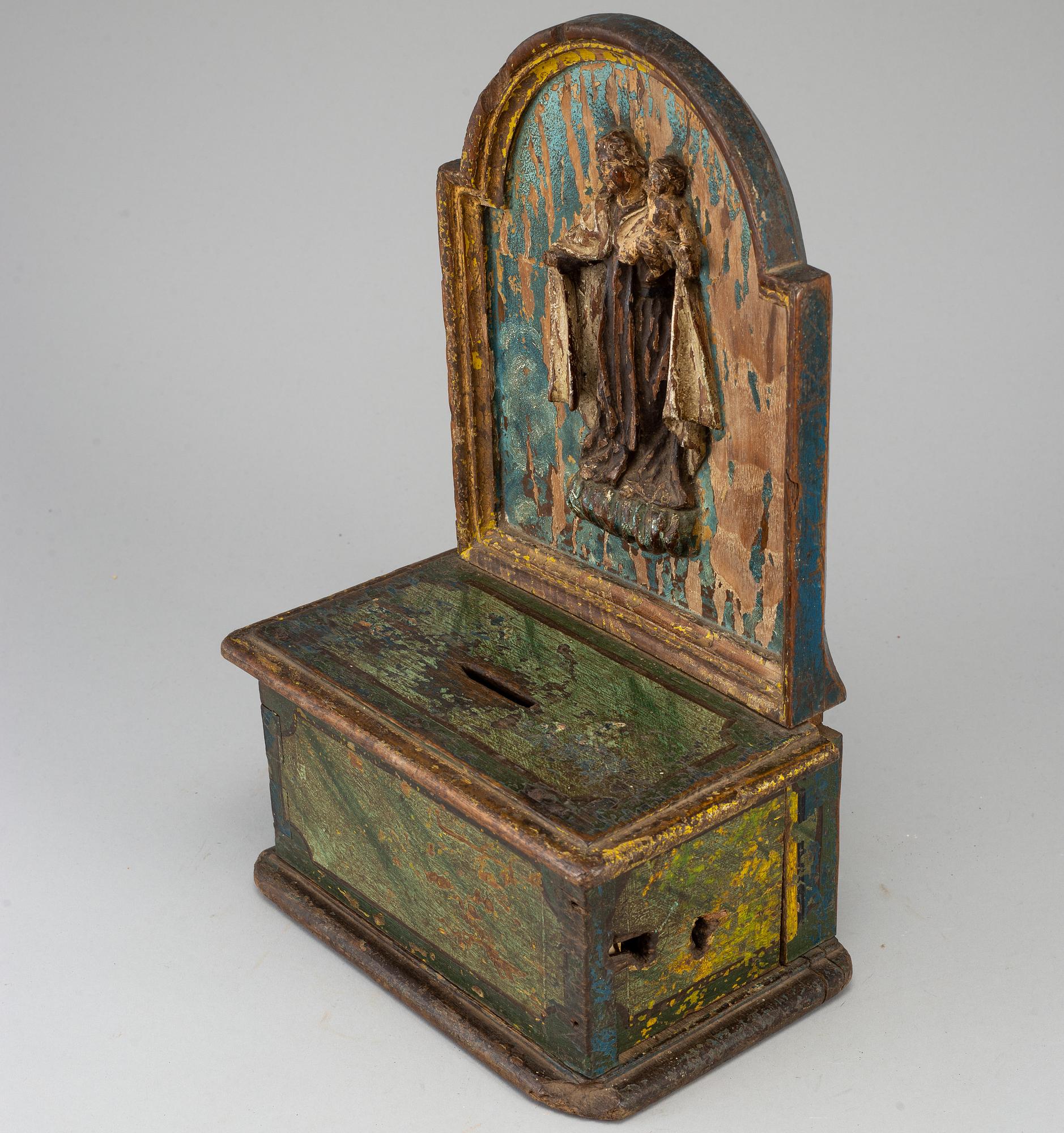 A painted wood alms box, probably 17th century.