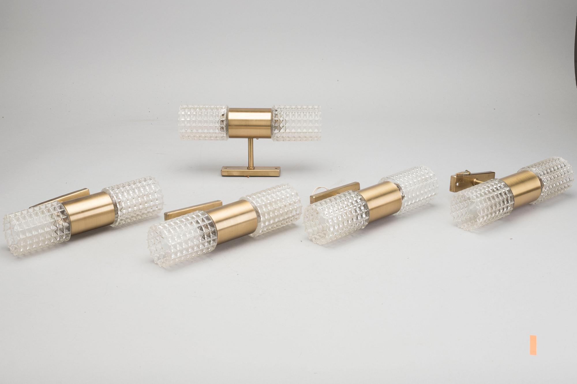 Five second half of the 20th century metal and glass wall sconces.