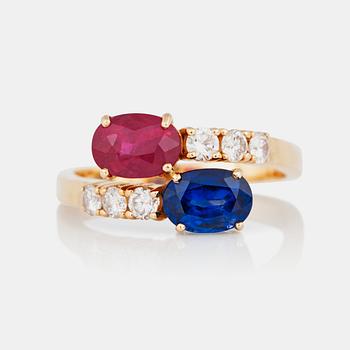 A 1.40ct ruby, 1.51ct sapphire and diamond ring.