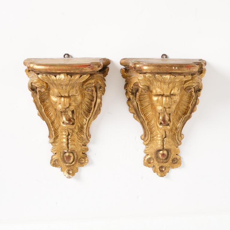 A pair of Swedish rococo giltwood consoles in the manner of C. Hårleman, Stockholm mid 18th century.