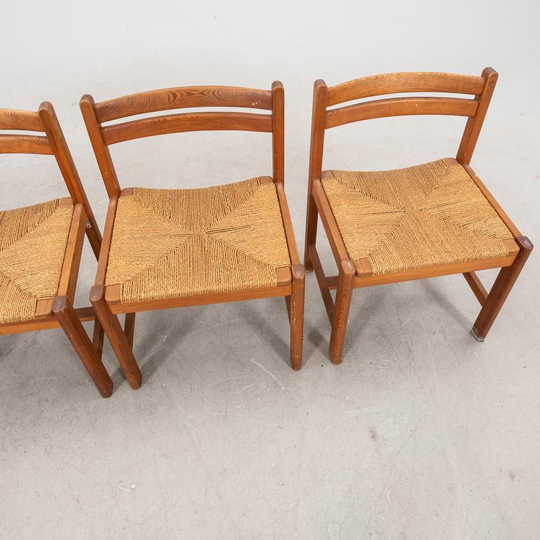 A set of four 1970s pine chairs.