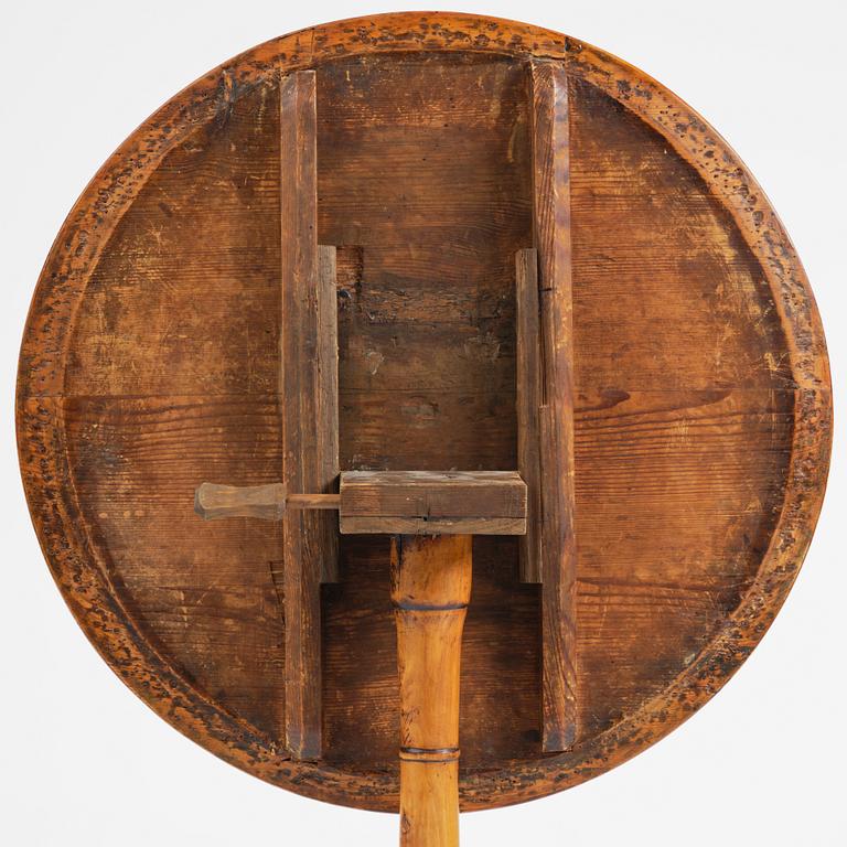 A tilt top table, from around the year 1800.