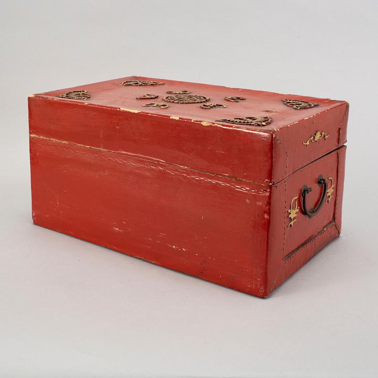 A red and gilt lacquered 'marriage' chest, late Qing dynasty.