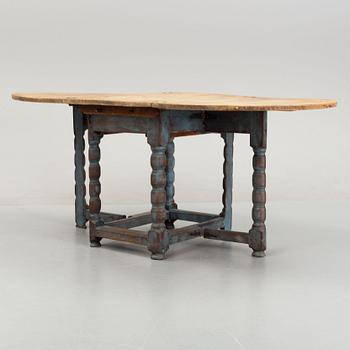 A 19th Century painted gate leg table.