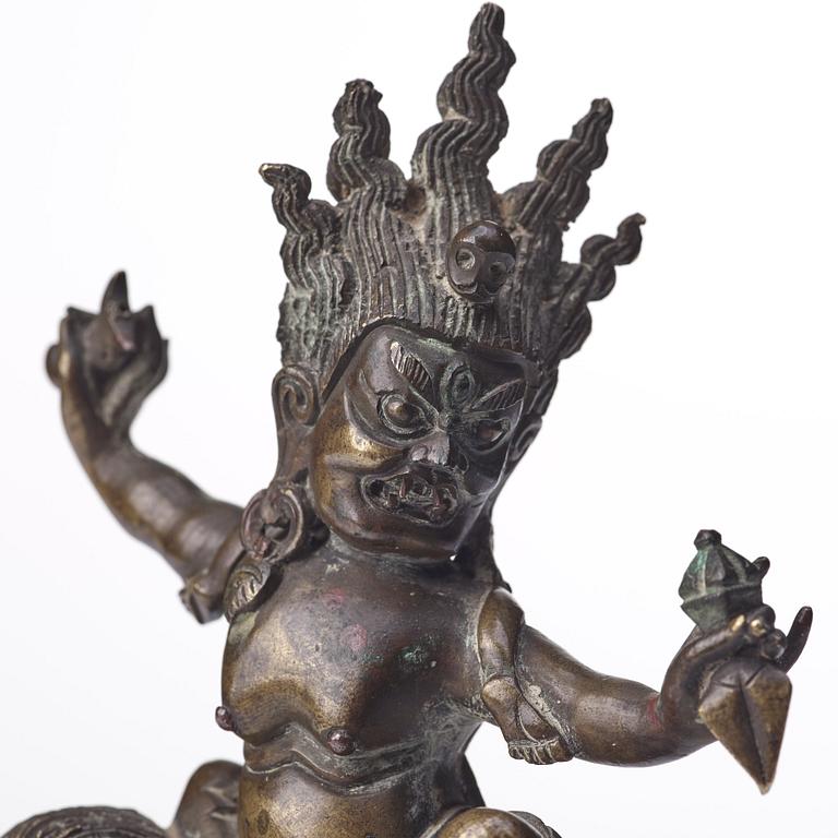 A Tibeto-Chinese bronze figure of a Rakshasi, ca 1900.