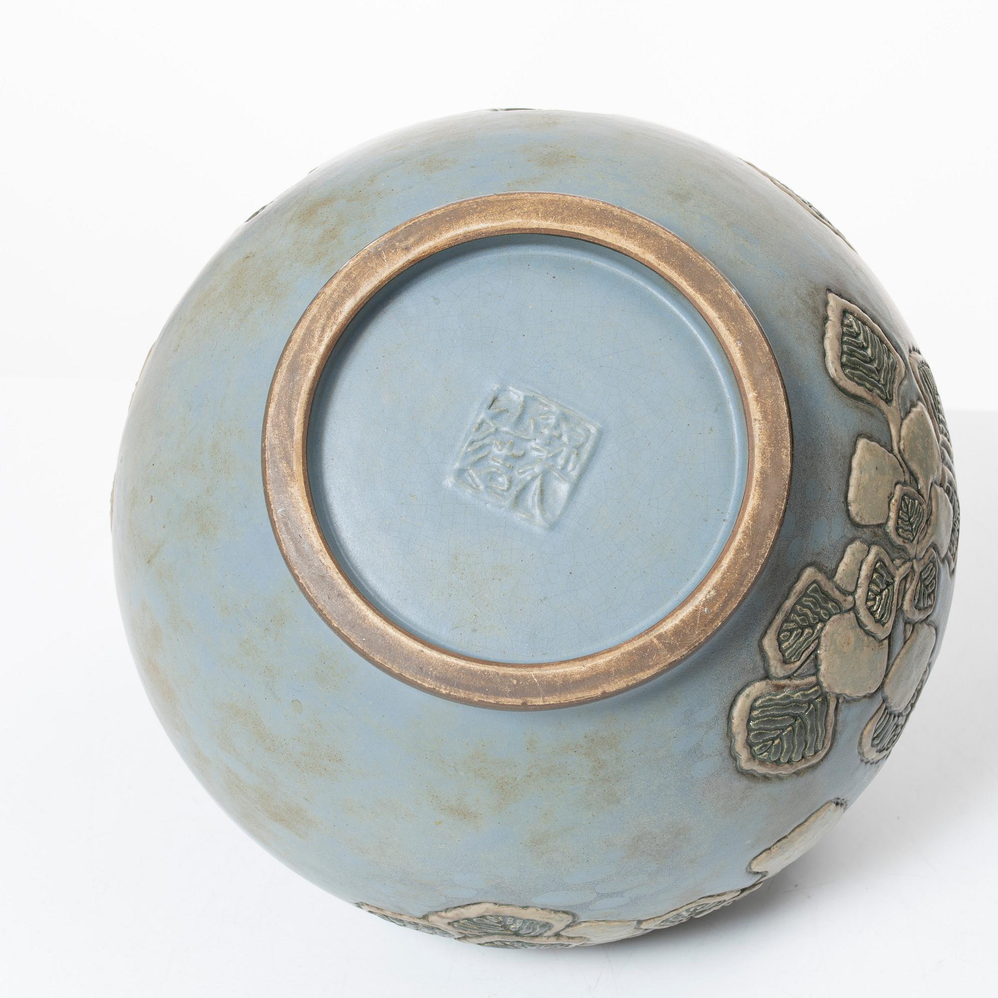 A blue glazed relief vase, possibly Korea, around 1900.