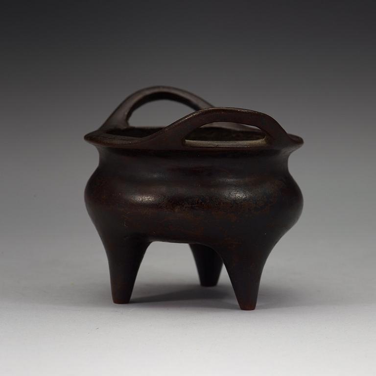 A copper alloy tripod censer, Ming dynasty, 17th Century with Xuandes four character mark.