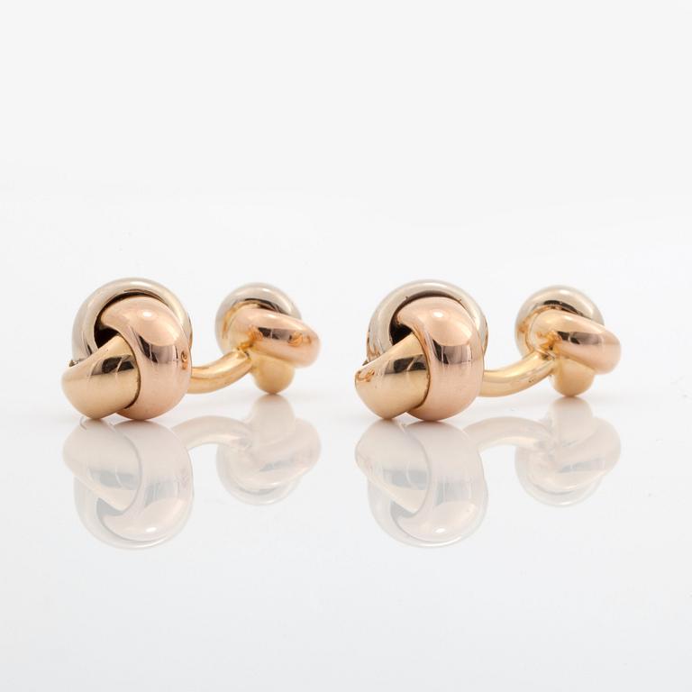 A pair of Cartier "Trinity" cufflinks. Serial number K02862.