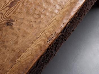Gustaf Fjaestad, an Art Nouveau carved pine table, Arvika Sweden 1914, a double to the table in the Thiel Collection,