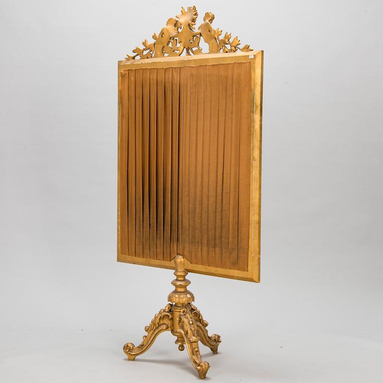 A late 19th century fire screen.