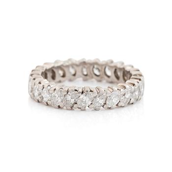 462. A Cartier platinum eternity ring set with navette-cut diamonds.