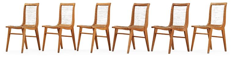 A Louis Sognot set of six ash, metal and rubber chairs, France 1950's.