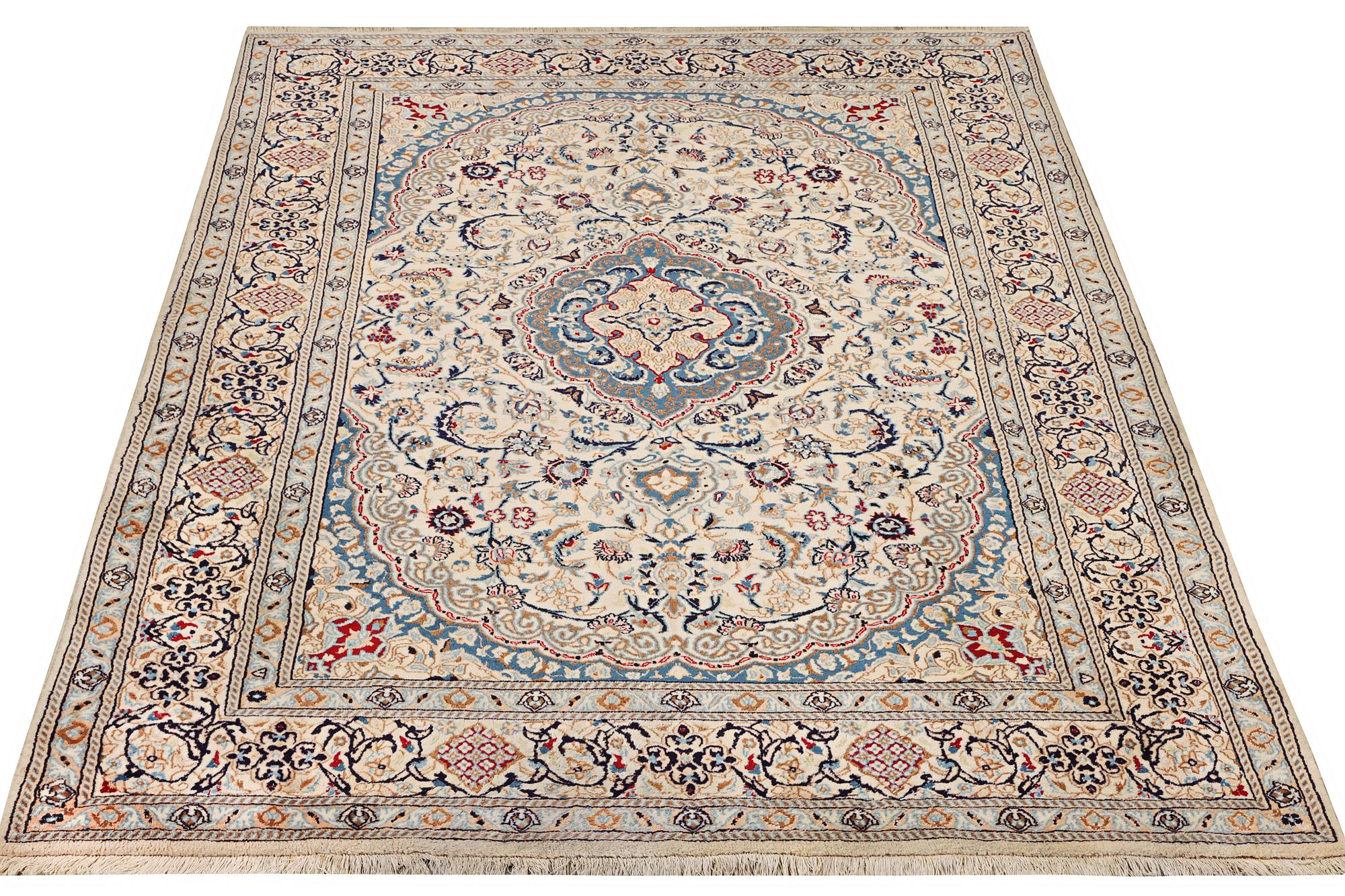 A Nain carpet, part silk, 9 laa, c. 300 x 195 cm.